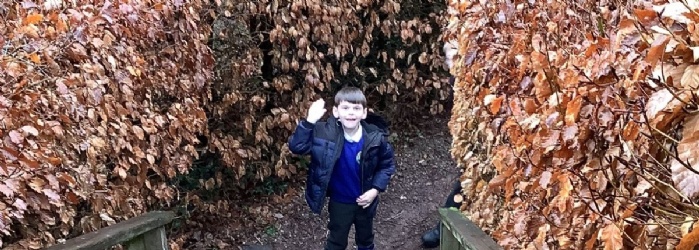 Whipton Barton Pupils Experience 'Living Saxon History' pupil outside with hand up